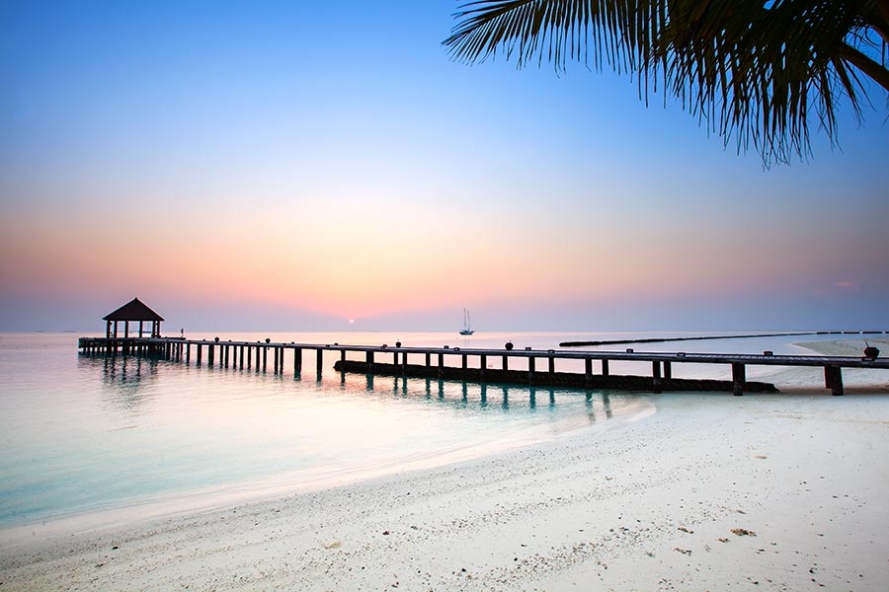sunrise on the island of komandoo in the maldives