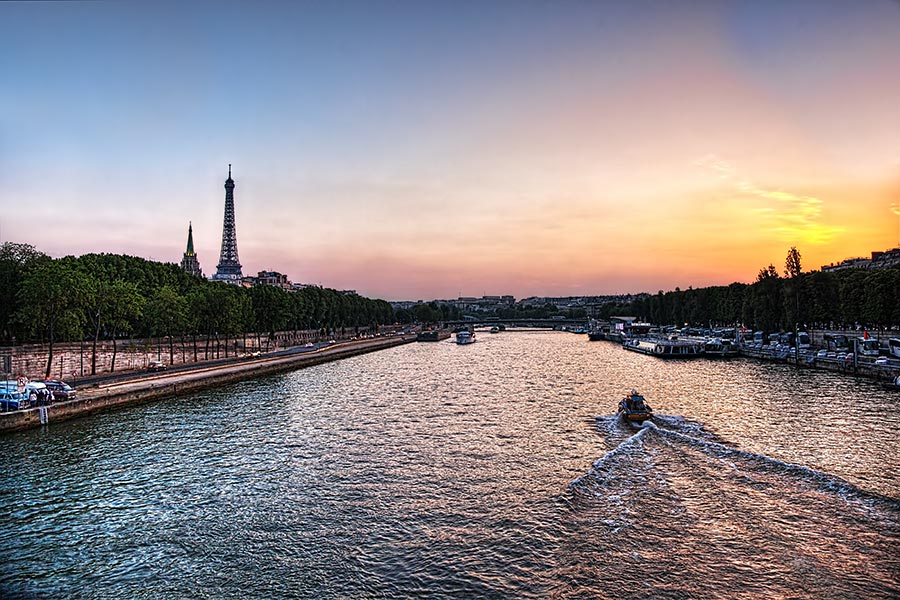 sunset from pont de l'alma over the river seine in paris, france