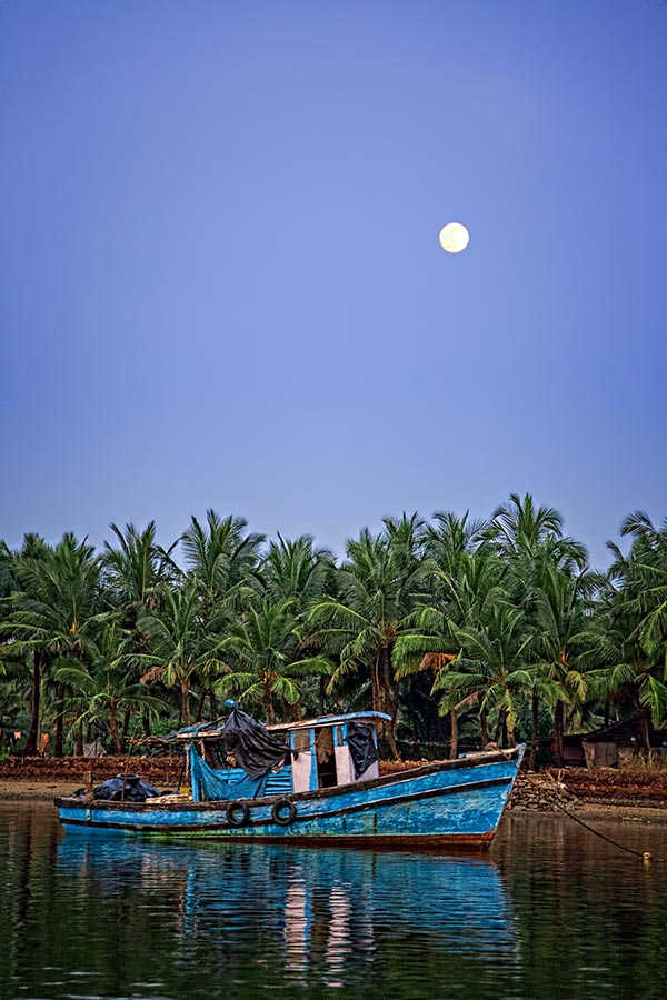 fishing boat on the river sal in goa, india