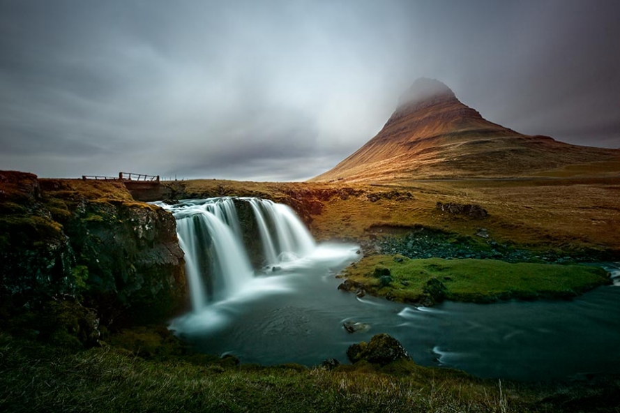 Kirkjufellfoss waterfall and the mountain Kirkjufell in Iceland